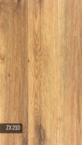 کفپوش PVC زدایکس ZX انتخابی هوشمندانه، زیبا و مقرونبهصرفه برای فضای زندگی شما کفپوش ZX PVC از برند معتبر زدایکس با ضخامت ۲ میلیمتر، یک گزینهی ایدهآل برای کسانی است که بهدنبال ظاهری شیک و چوبمانند در کنار قیمت مناسب هستند. این کفپوش با ابعاد ۱۵×۹۰ سانتیمتر، طراحیهایی بسیار نزدیک به پارکت لمینت دارد و بافت طبیعی چوب را با سبکی اقتصادی ارائه میدهد. نصب این محصول بهصورت چسبی انجام میشود که باعث میشود بهخوبی به سطح زمین بچسبد و ثبات بالایی داشته باشد. مدل ZX برای استفاده در فضاهای مسکونی طراحی شده و برای اتاق خواب، نشیمن، راهرو و... کاملاً مناسب است. --- ویژگیهای کفپوش ZX PVC: *طراحی مشابه پارکت، با بافت طبیعی و رنگهای متنوع *ضخامت ۲ میلیمتر *سبک و مناسب برای نصب روی سطوح صاف *نصب با چسب مخصوص(خمیری یا صنعتی) *چسبندگی بالا و اجرای یکنواخت *مناسب برای محیطهای مسکونی *انتخابی مقرونبهصرفه در مقایسه با پارکت لمینت *مقاوم در برابر رطوبت و قابل شستوشو